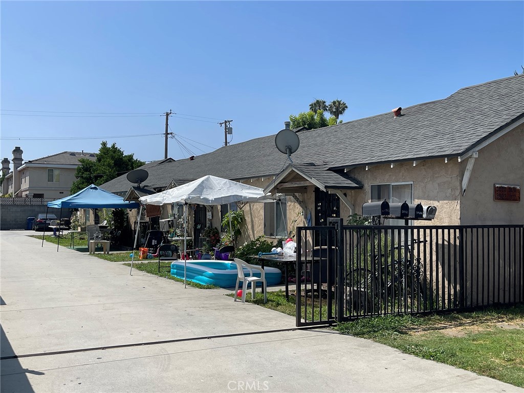 3020 Cogswell Road El Monte, CA 91732 - Photo 1 of 1 a view of a patio with a table and chairs under an umbrella