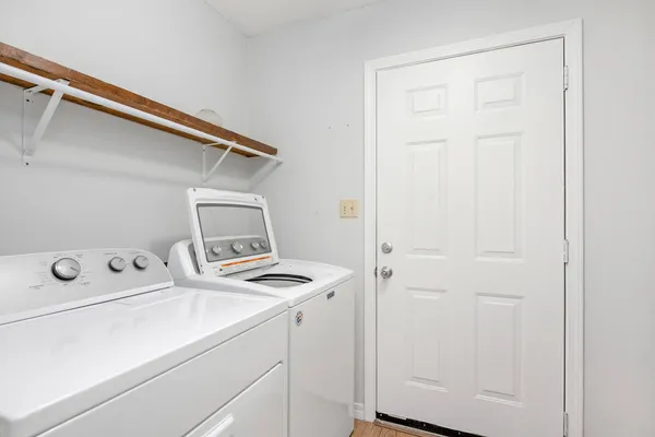 a kitchen with stainless steel appliances granite countertop a sink and a refrigerator