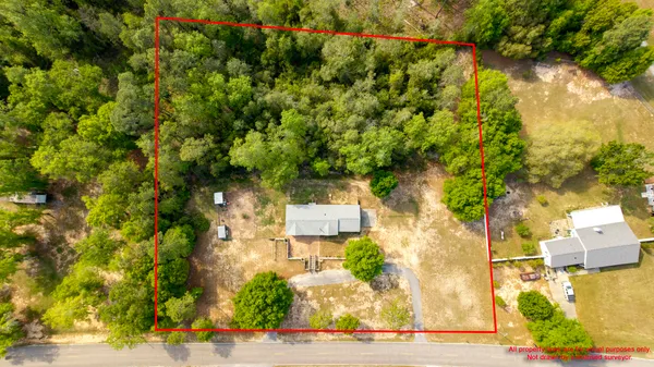 a view of house with backyard
