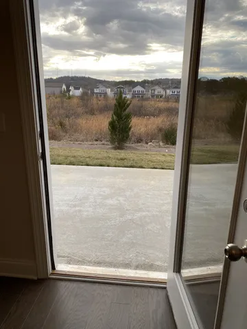 a view of an empty room with closet area