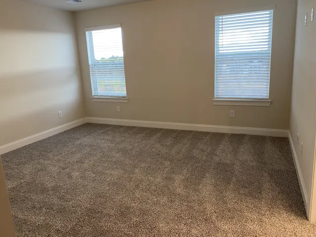 a bathroom with a shower sink and mirror