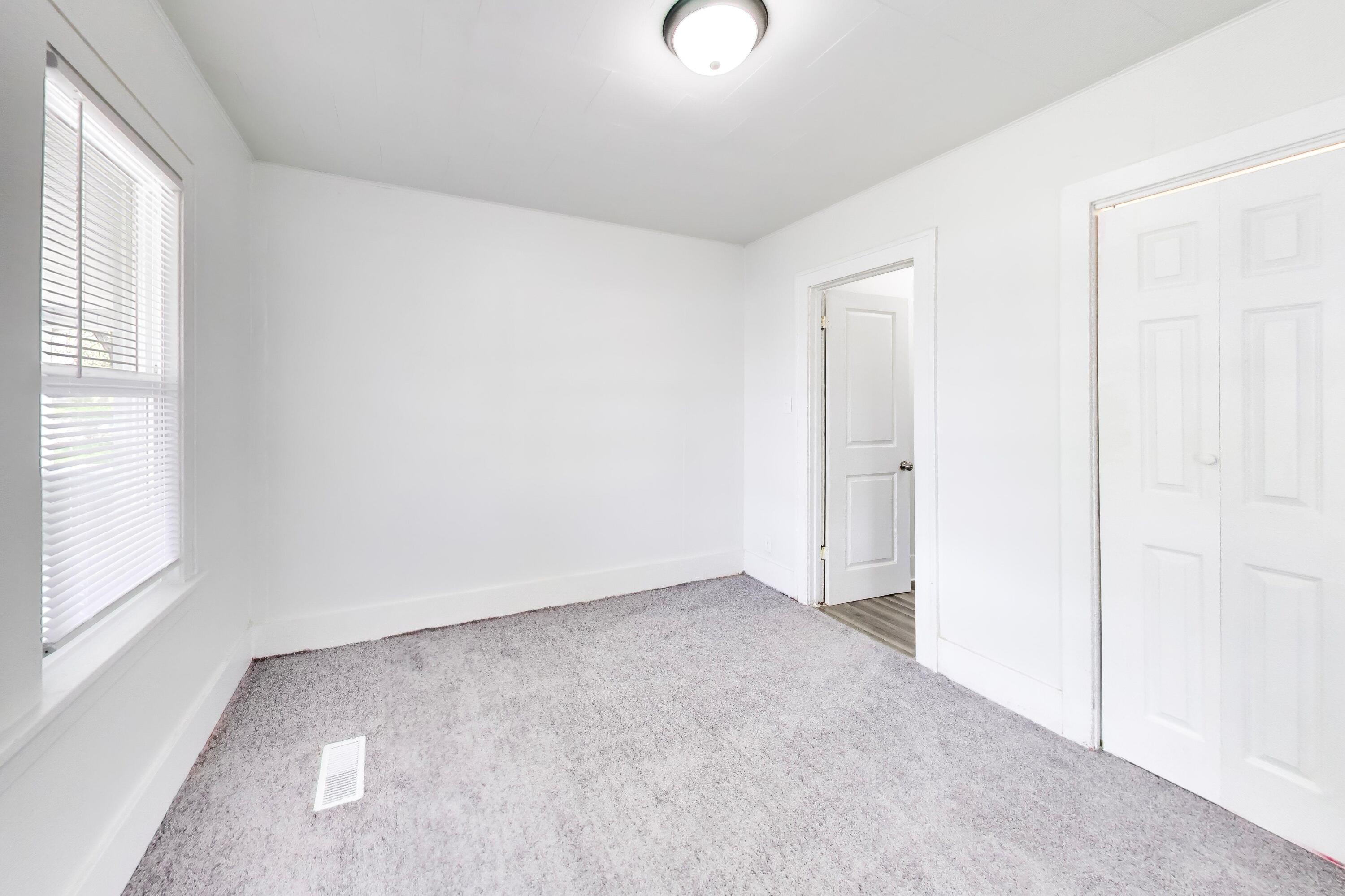 121 Faulkner Street Michigan City, IN 46360 - Photo 11 of 15 an empty room with windows