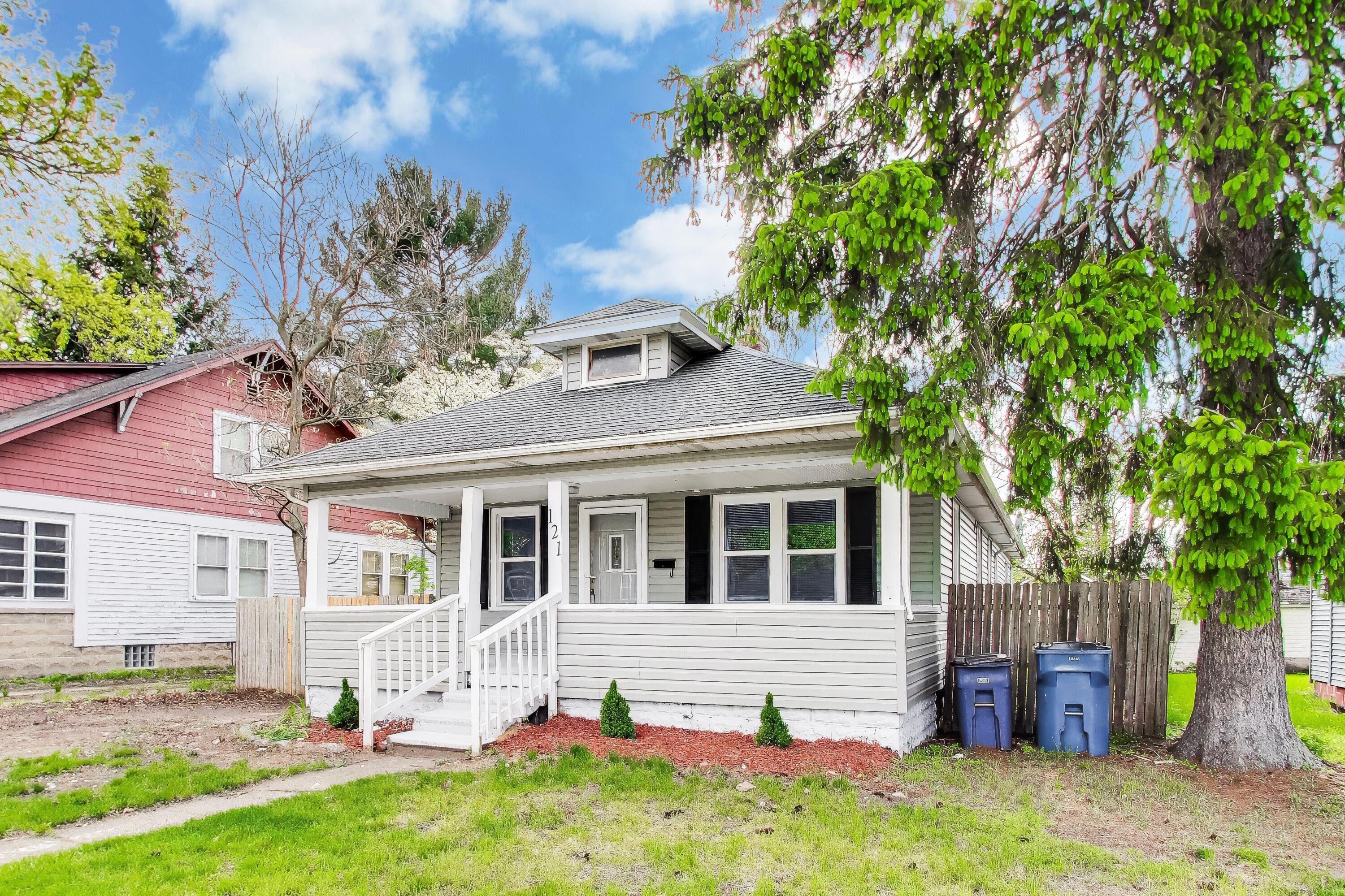 121 Faulkner Street Michigan City, IN 46360 - Photo 2 of 15 a front view of a house with a yard