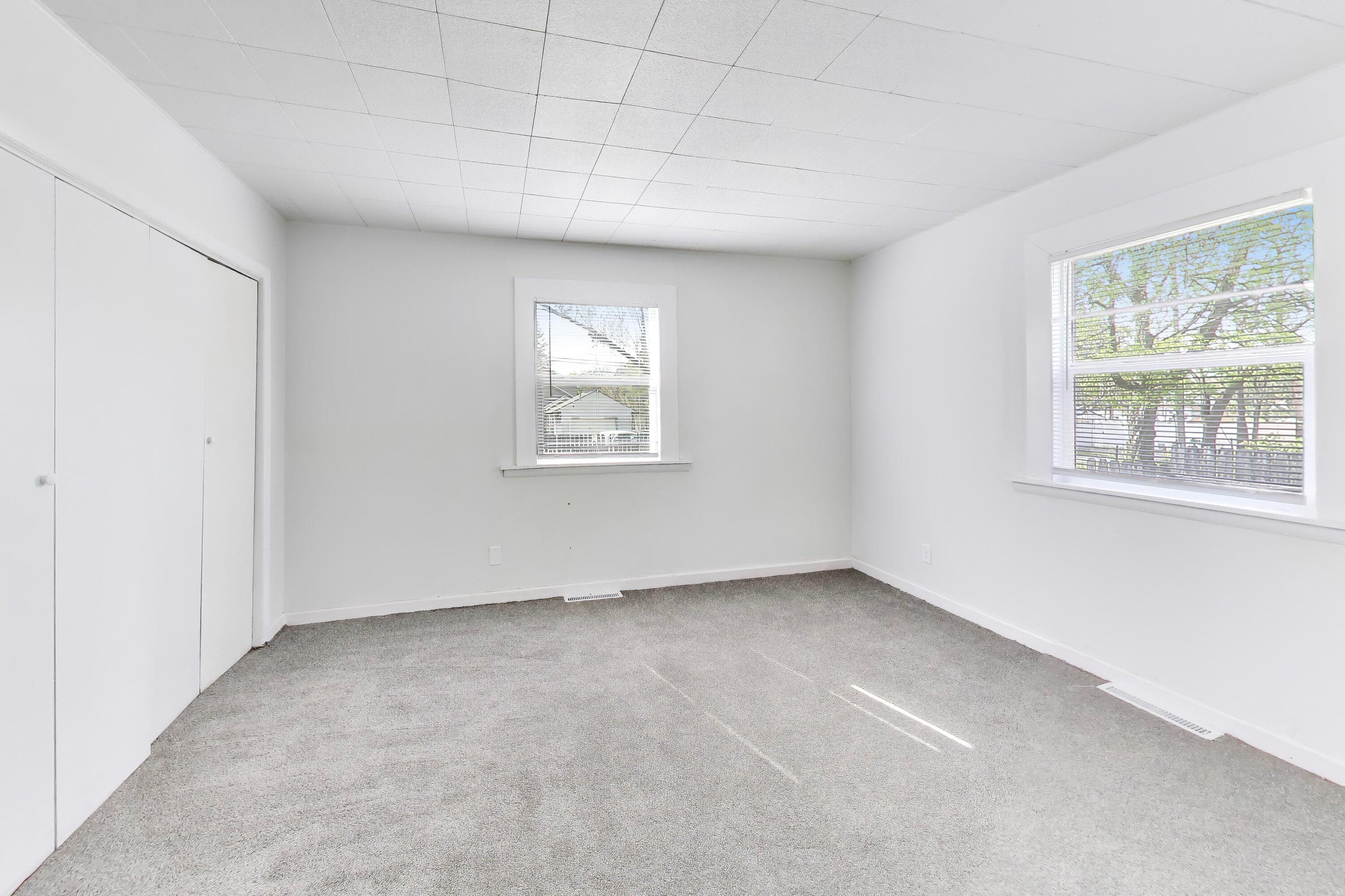 121 Faulkner Street Michigan City, IN 46360 - Photo 9 of 15 an empty room with windows