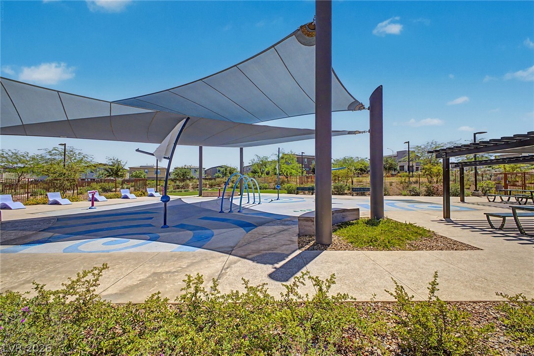 226 Augusta Ridge Henderson, NV 89015 - Photo 46 of 47 This vibrant splash pad and recreational space offers refreshing outdoor enjoyment under a bright sky.