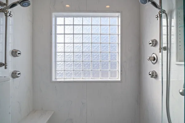 a bathroom with a sink a toilet and a shower