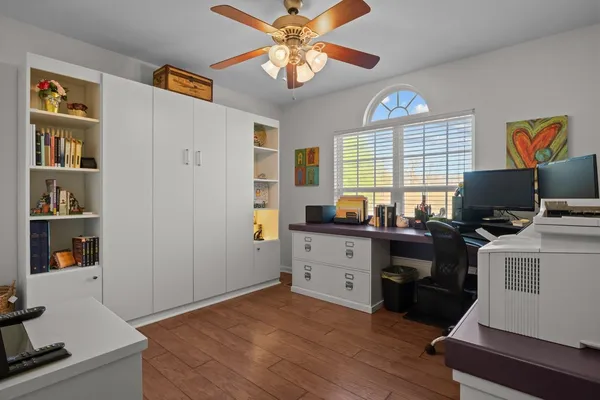 a bedroom with two beds and a chandelier