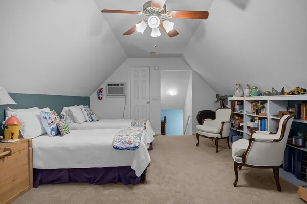 a view of a yard with wooden fence