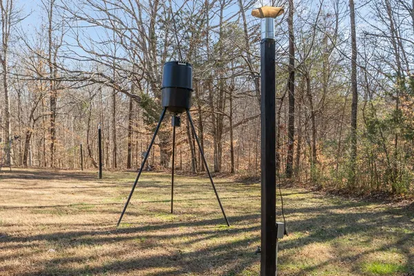 a tall yellow house with a snow in the background