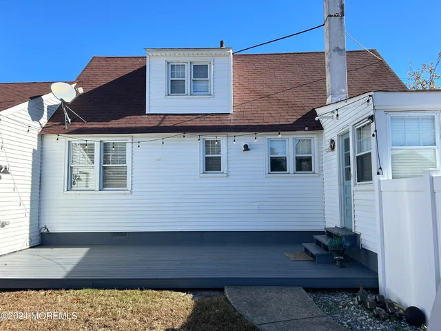 a view of a house with a large window