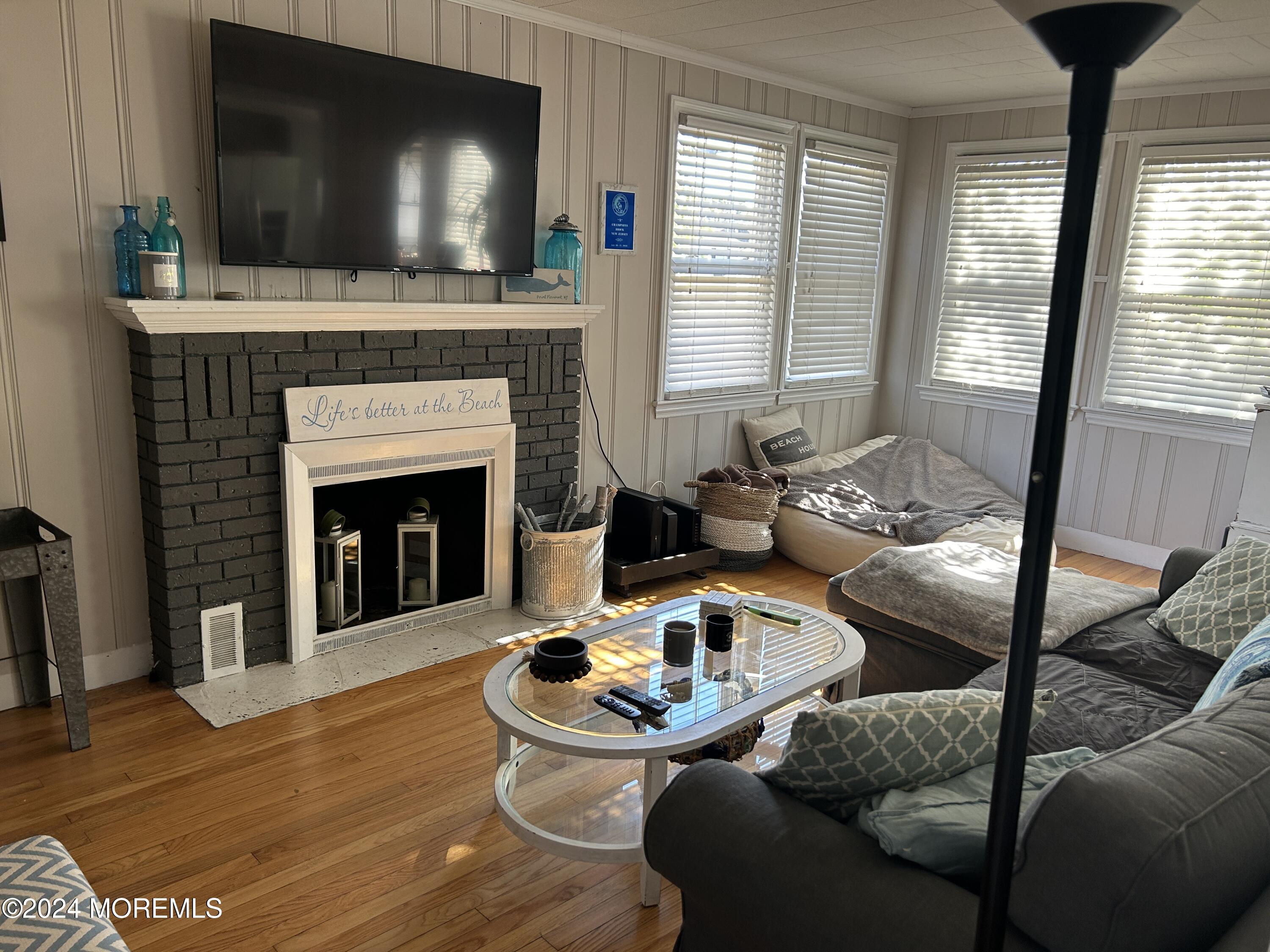 1527 Beaver Dam Road Point Pleasant, NJ 08742 - Photo 2 of 16 a living room with furniture and a flat screen tv