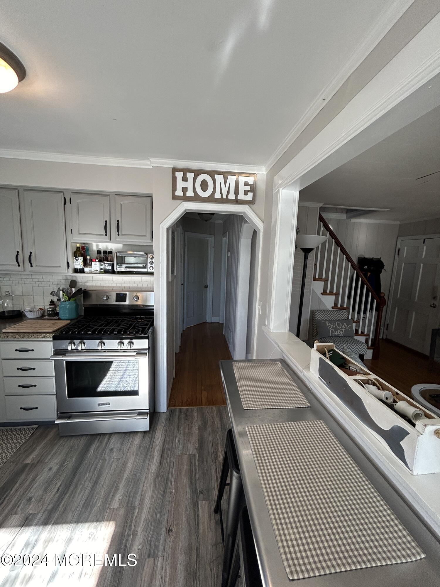 1527 Beaver Dam Road Point Pleasant, NJ 08742 - Photo 7 of 16 a kitchen with kitchen island a stove and a refrigerator