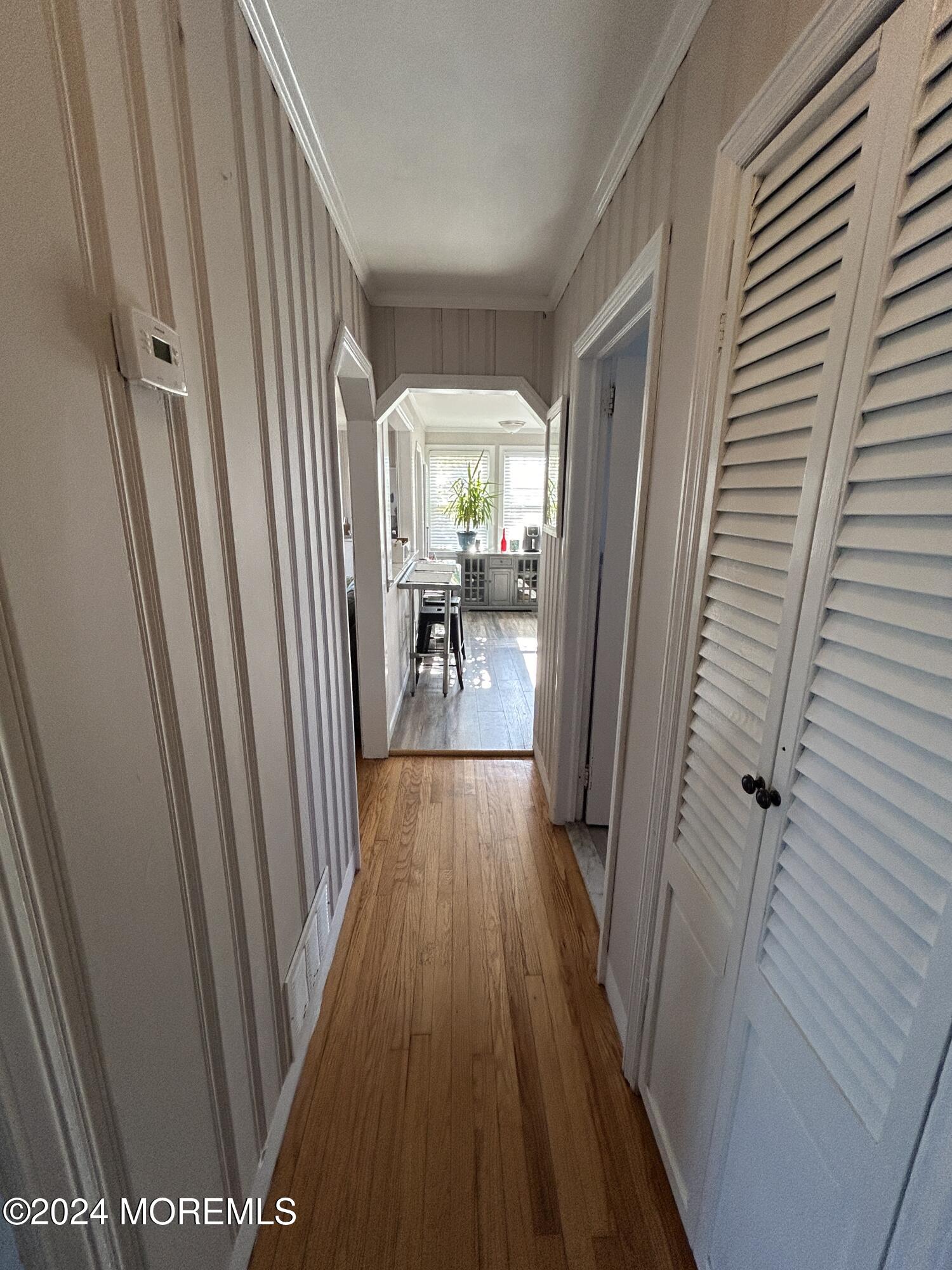 1527 Beaver Dam Road Point Pleasant, NJ 08742 - Photo 10 of 16 a view of a hallway with wooden floor and staircase