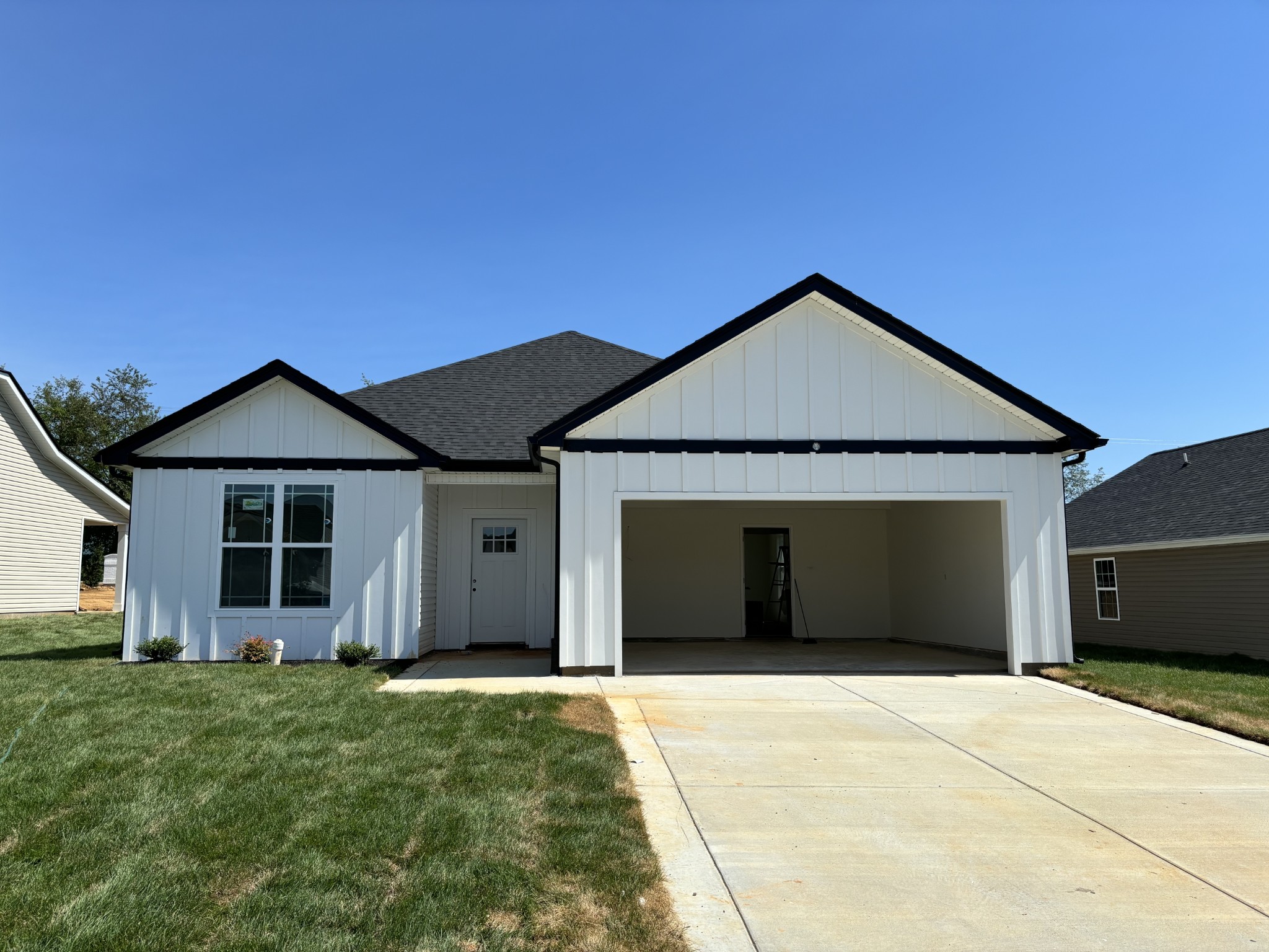 2069 Michael Drive Springfield, TN 37172 - Photo 1 of 1 a front view of a house with a garden and garage