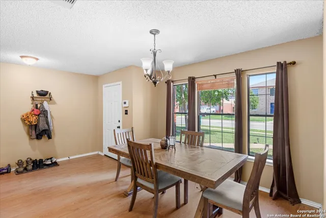 a view of a dining room with furniture window and outside view