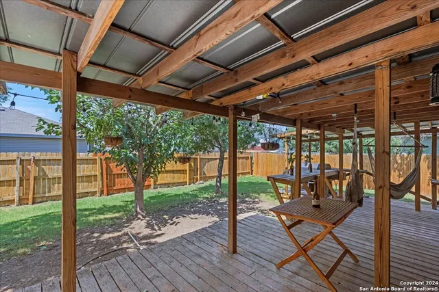 a view of a patio with wooden floor