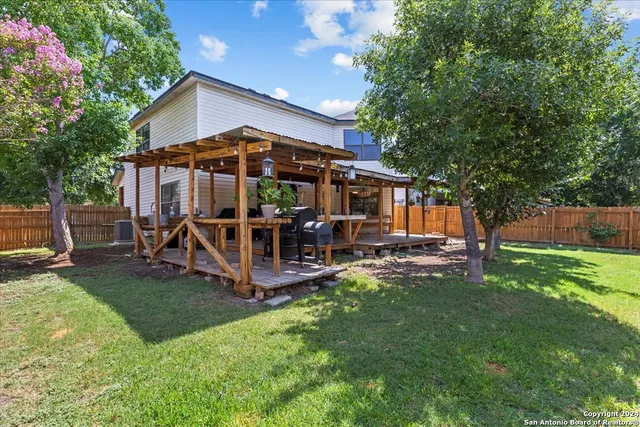 a view of a house with a yard porch and sitting area