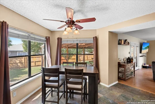 a view of a dining room with furniture window and outside view