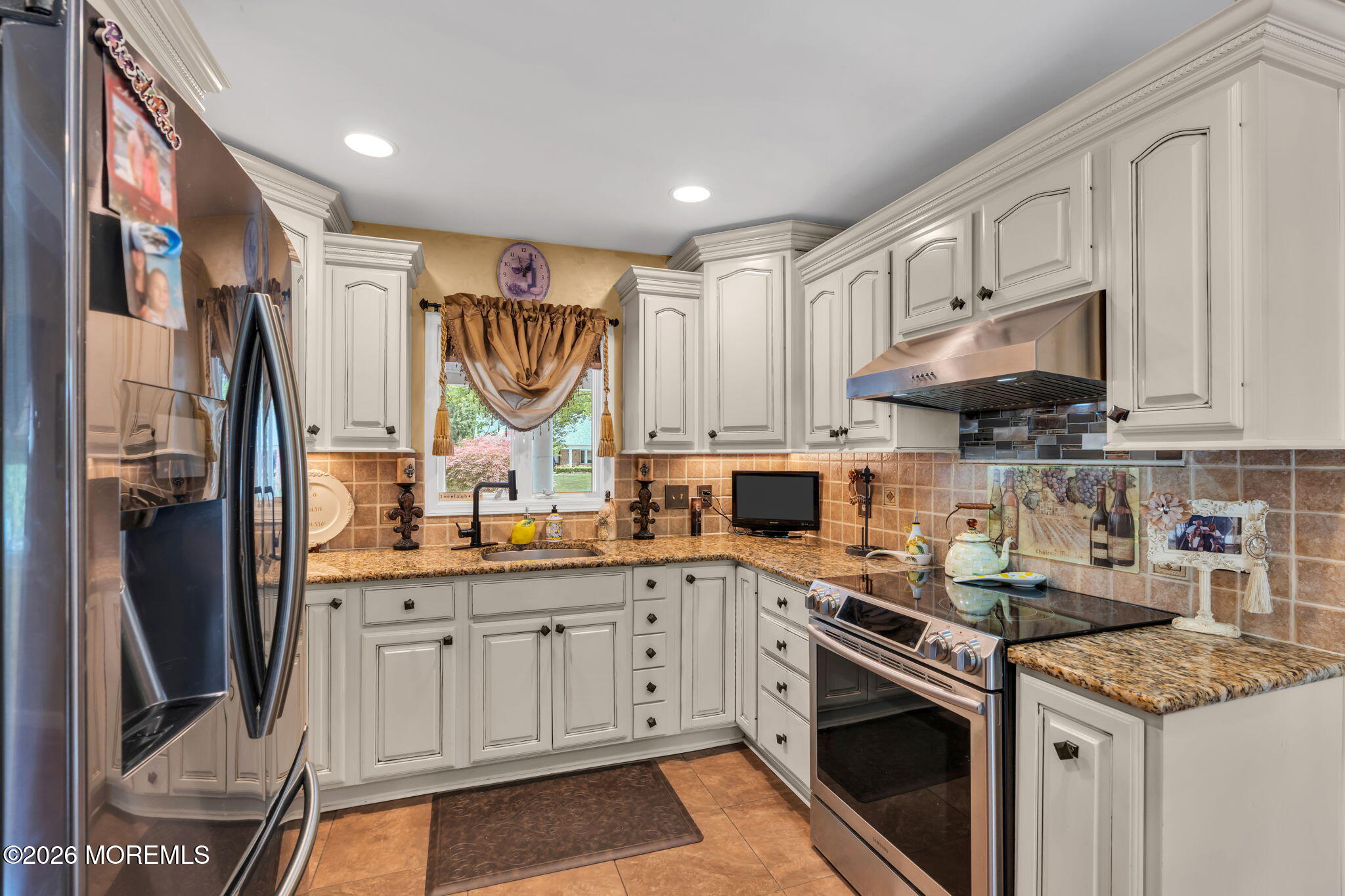 8 Owens Road Marlboro, NJ 07746 - Photo 15 of 39 a kitchen with stainless steel appliances granite countertop a stove sink and cabinets