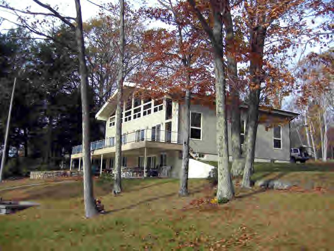 262-264 Kibbe Road Otis, MA 01029 - Photo 4 of 16 a house that has a tree in front of it