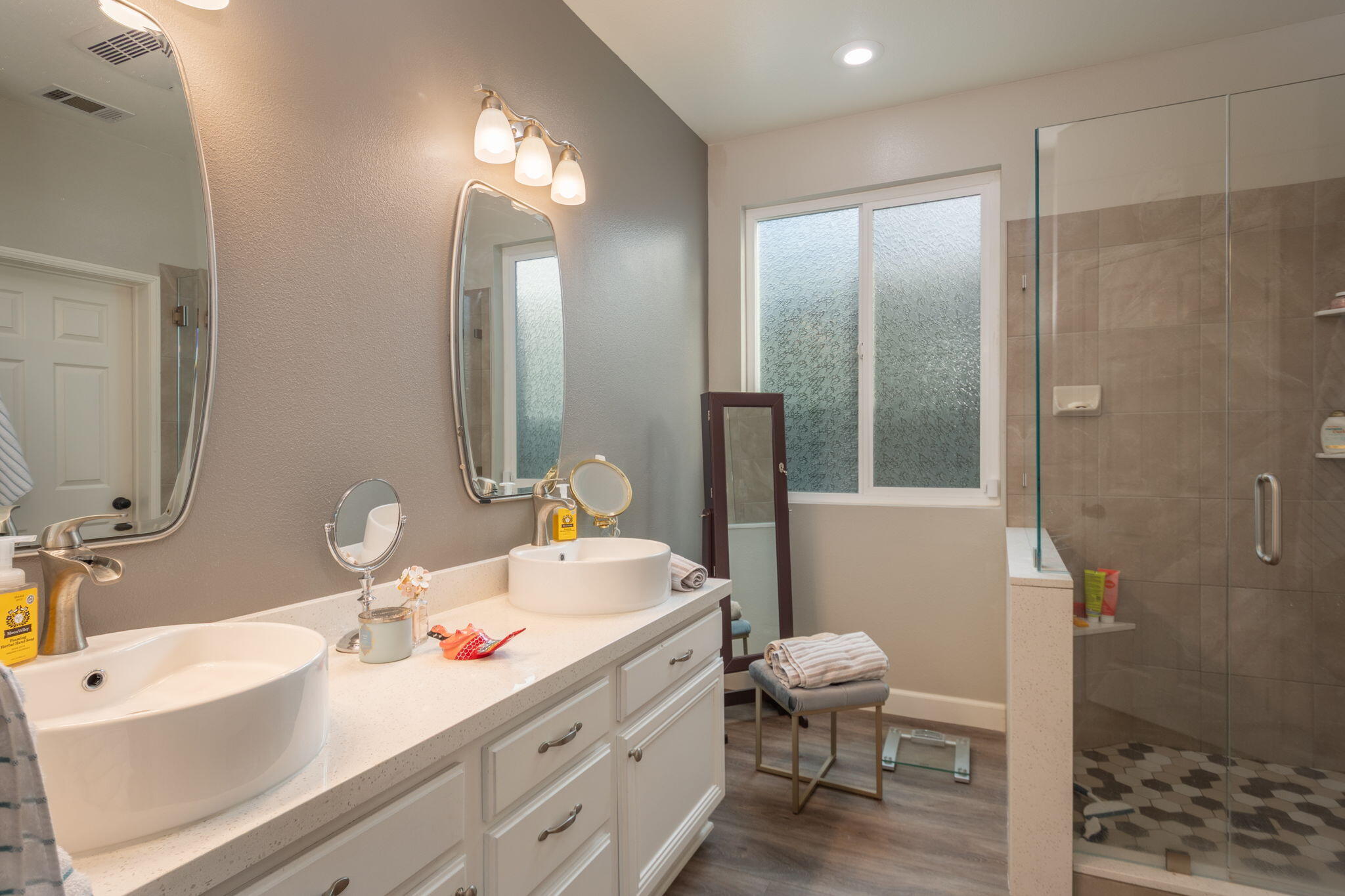 115 Ford Avenue Ventura, CA 93003 - Photo 17 of 33 a bathroom with a double vanity sink toilet mirror and shower