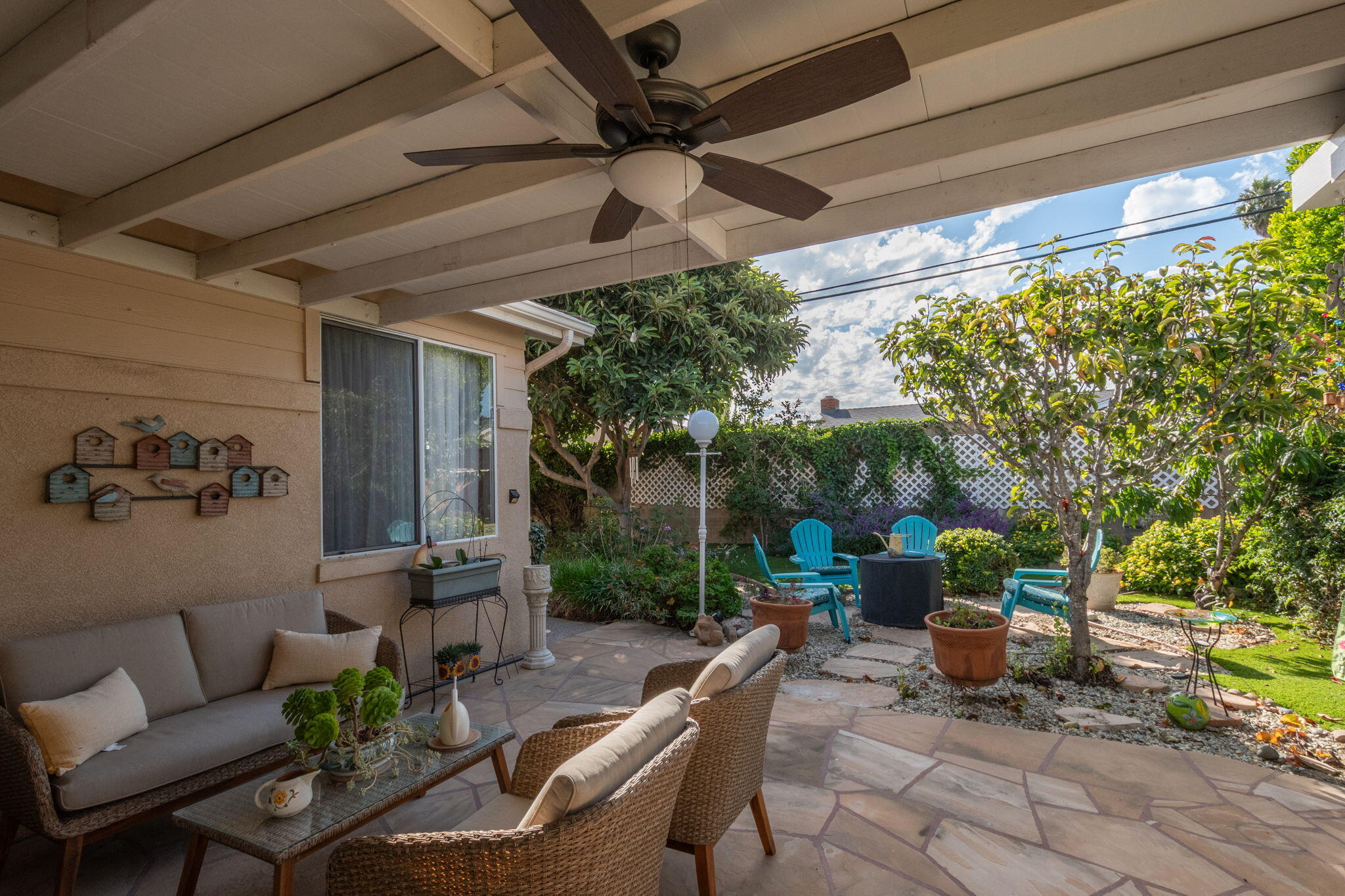 115 Ford Avenue Ventura, CA 93003 - Photo 22 of 33 a view of a patio with couches table and chairs and potted plants