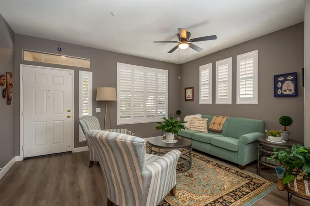 a living room with furniture and a large window