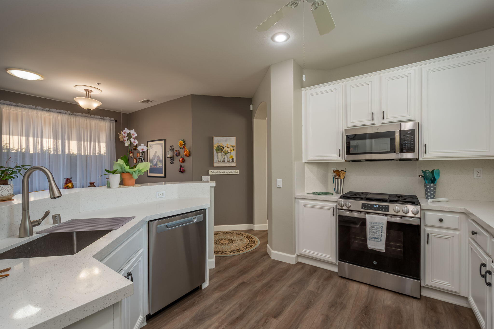 115 Ford Avenue Ventura, CA 93003 - Photo 9 of 33 a kitchen with a stove a sink and a microwave