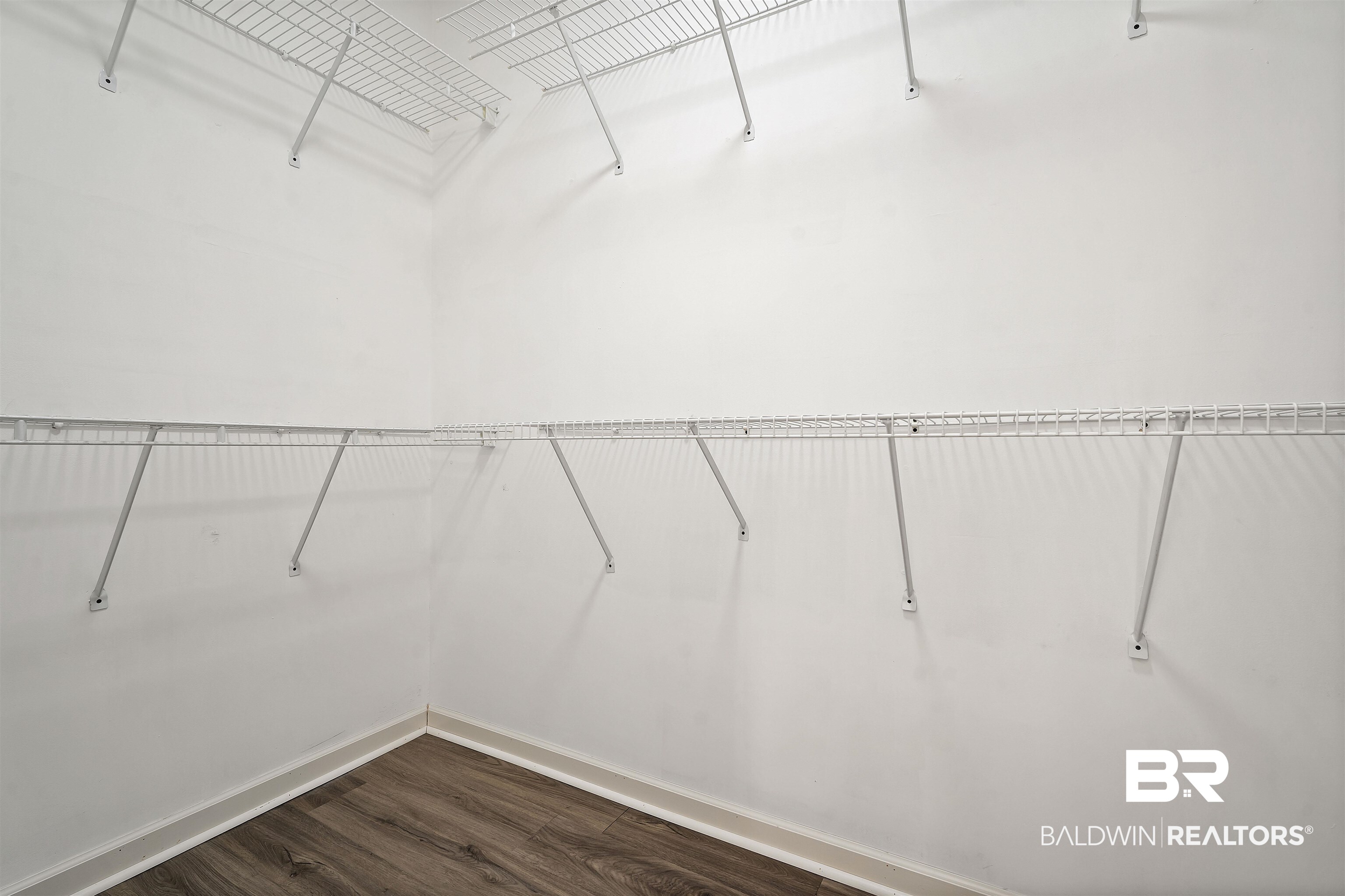 615 Summerlake Place Mobile, AL 36608 - Photo 21 of 35 Walk in closet with dark wood-style flooring