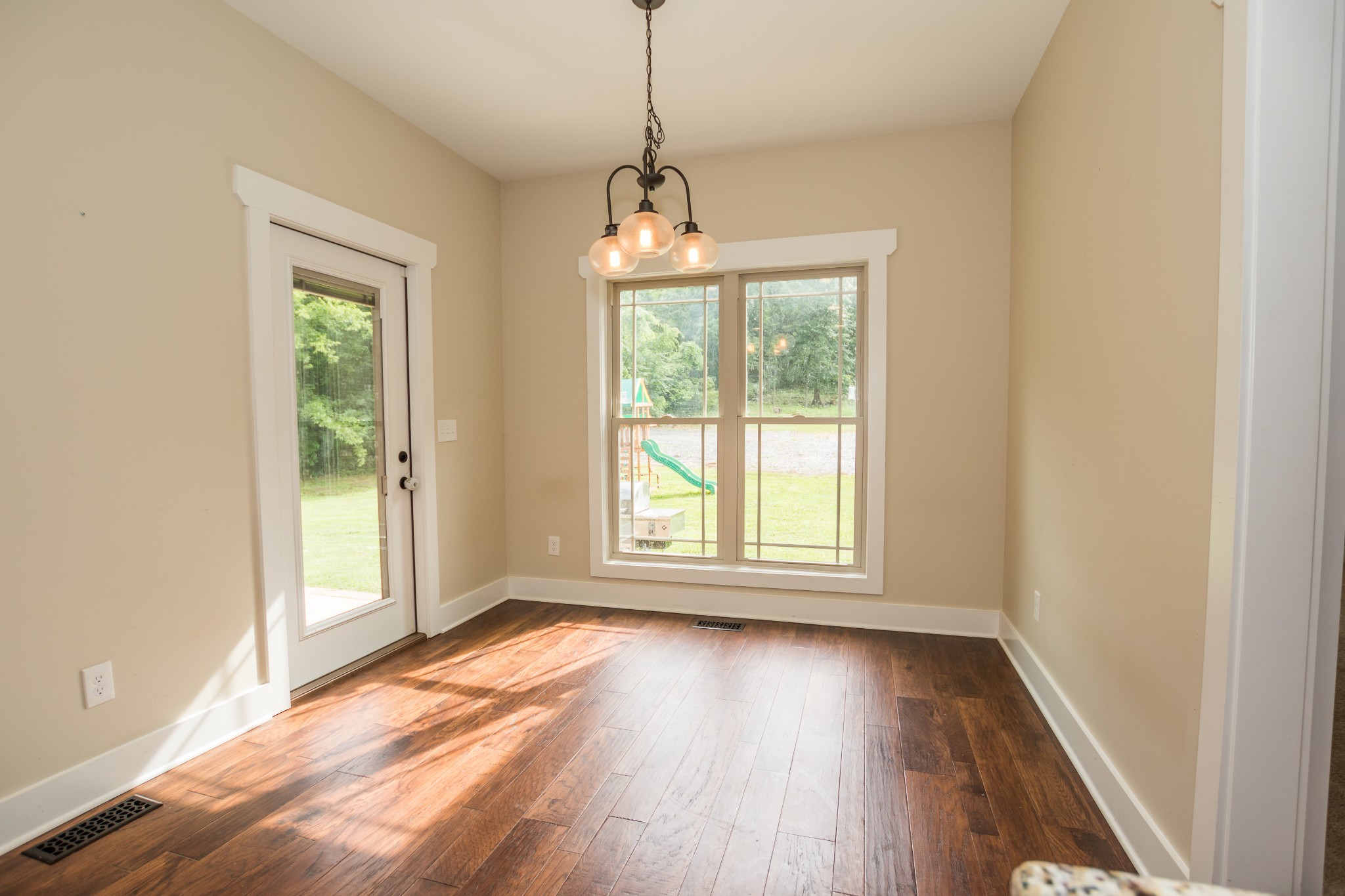 3597 Thompson Road Rockvale, TN 37153 - Photo 17 of 23 an empty room with wooden floor and windows