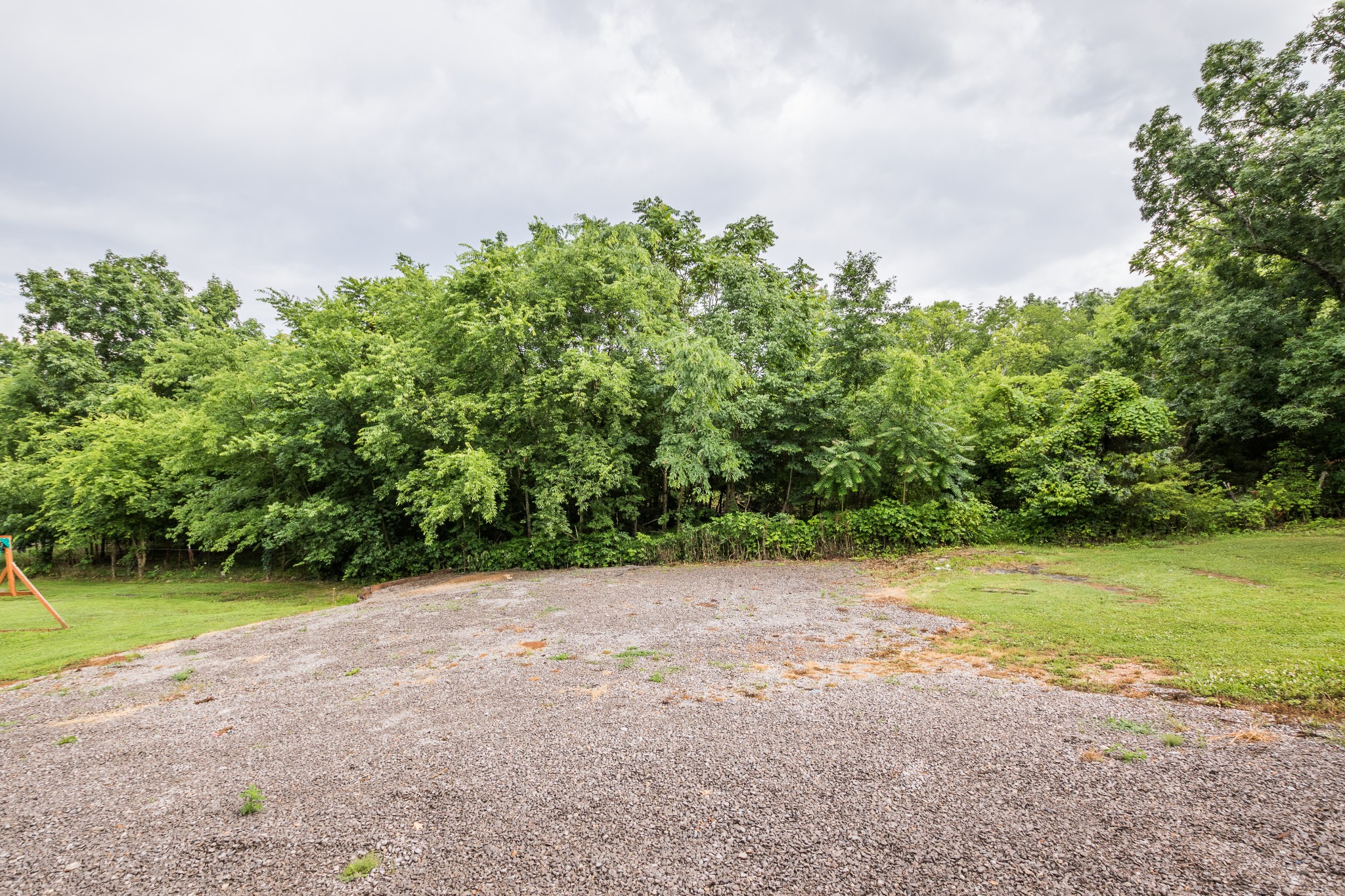 3597 Thompson Road Rockvale, TN 37153 - Photo 21 of 23 a view of a big yard with a trees