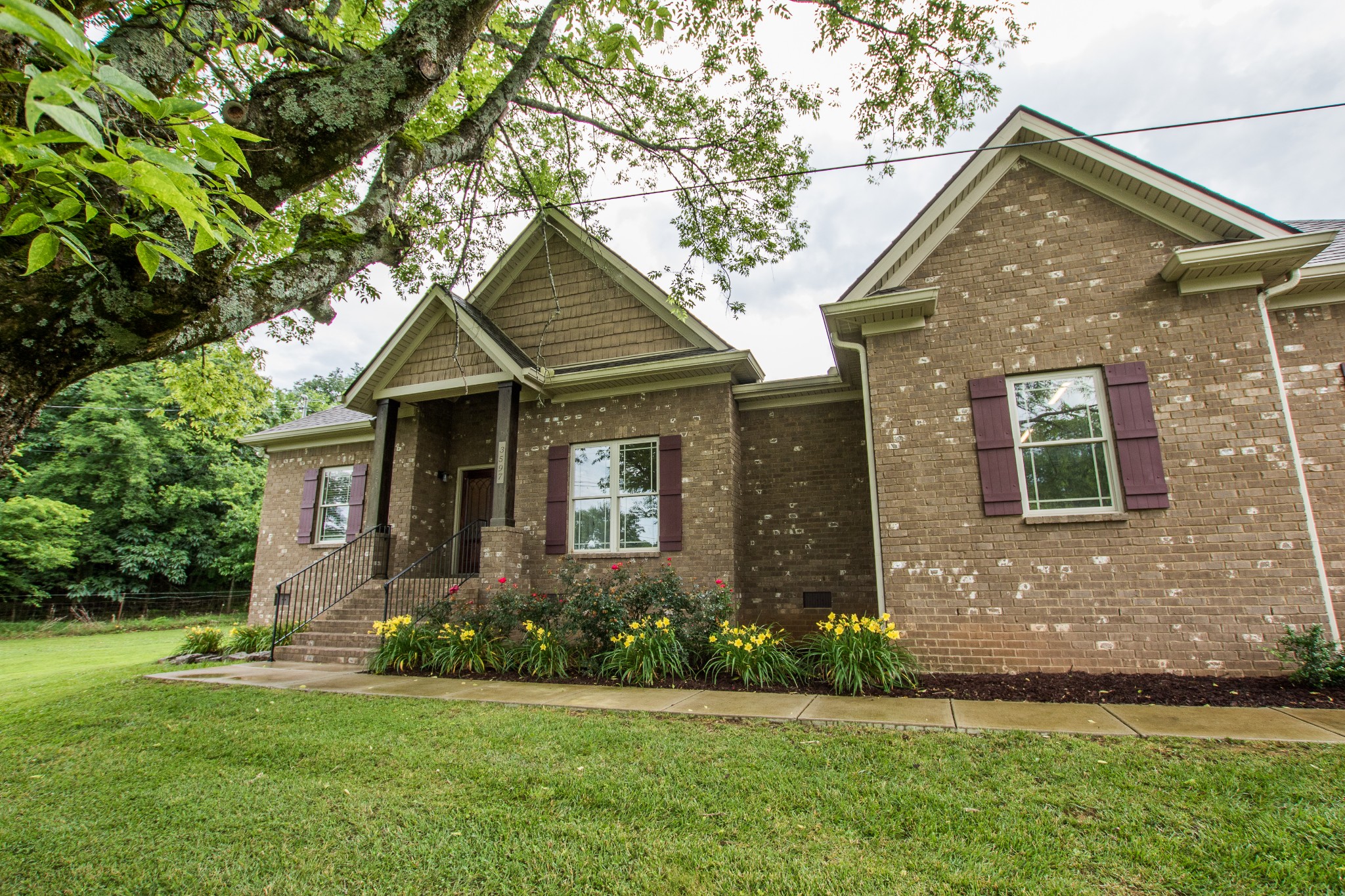 3597 Thompson Road Rockvale, TN 37153 - Photo 22 of 23 a front view of a house with a yard and trees