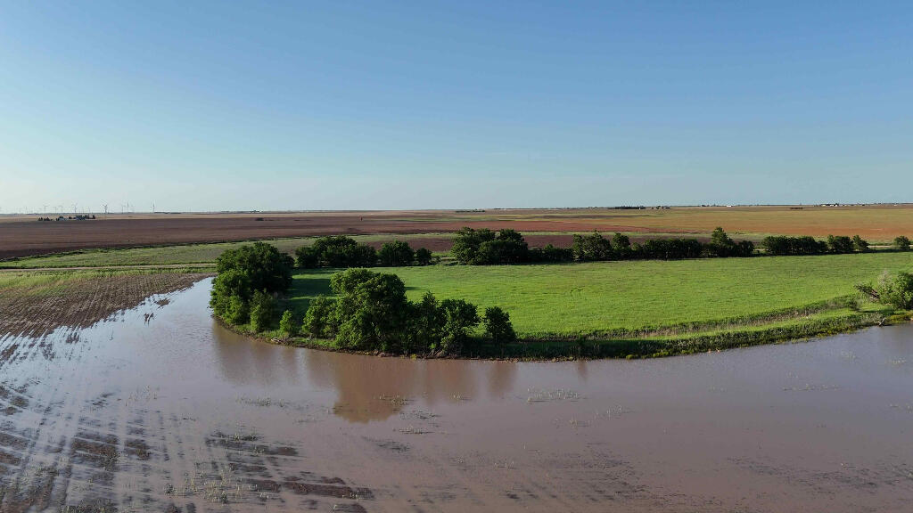 632 County Road 230 Post, TX 79356 - Photo 21 of 28 a view of a lake with a city