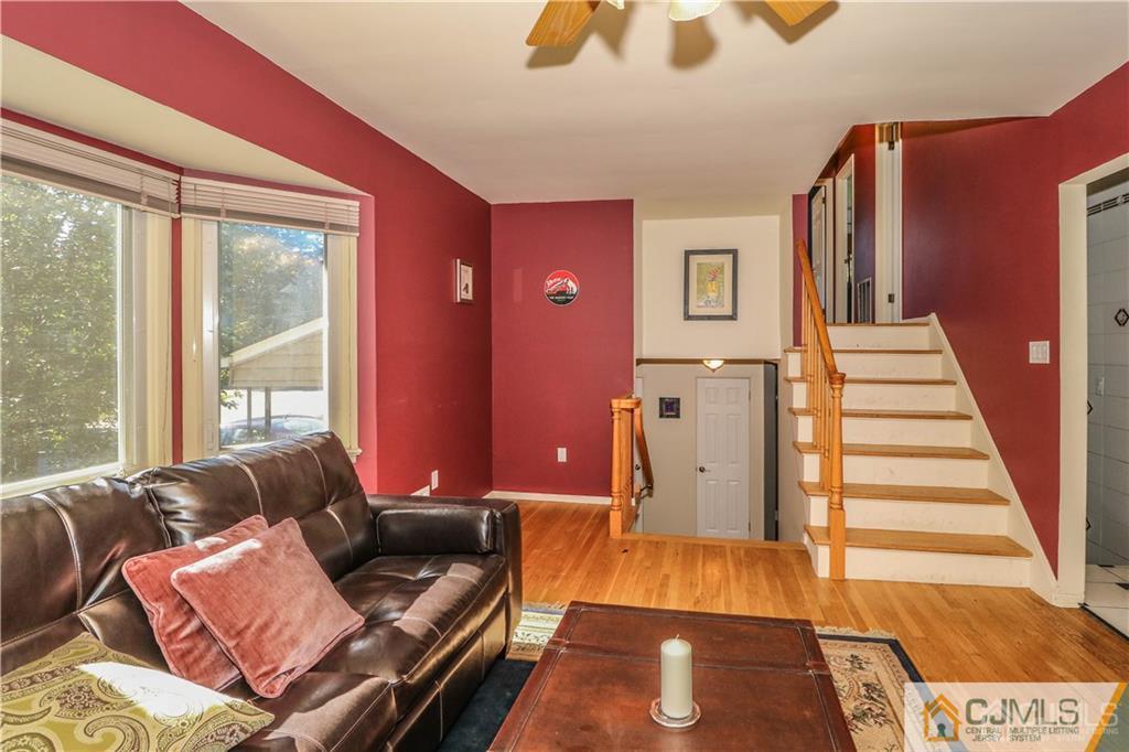 39 Outcalt Road Edison, NJ 08817 - Photo 11 of 17 a living room with furniture and a large window