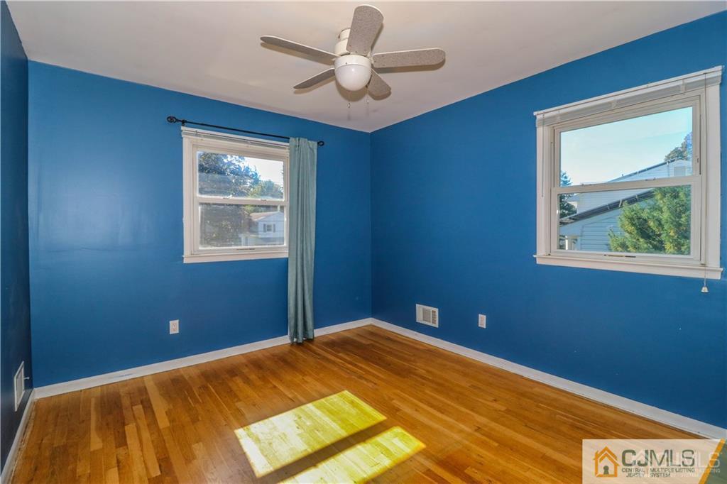 39 Outcalt Road Edison, NJ 08817 - Photo 13 of 17 a bedroom with a bed and a window
