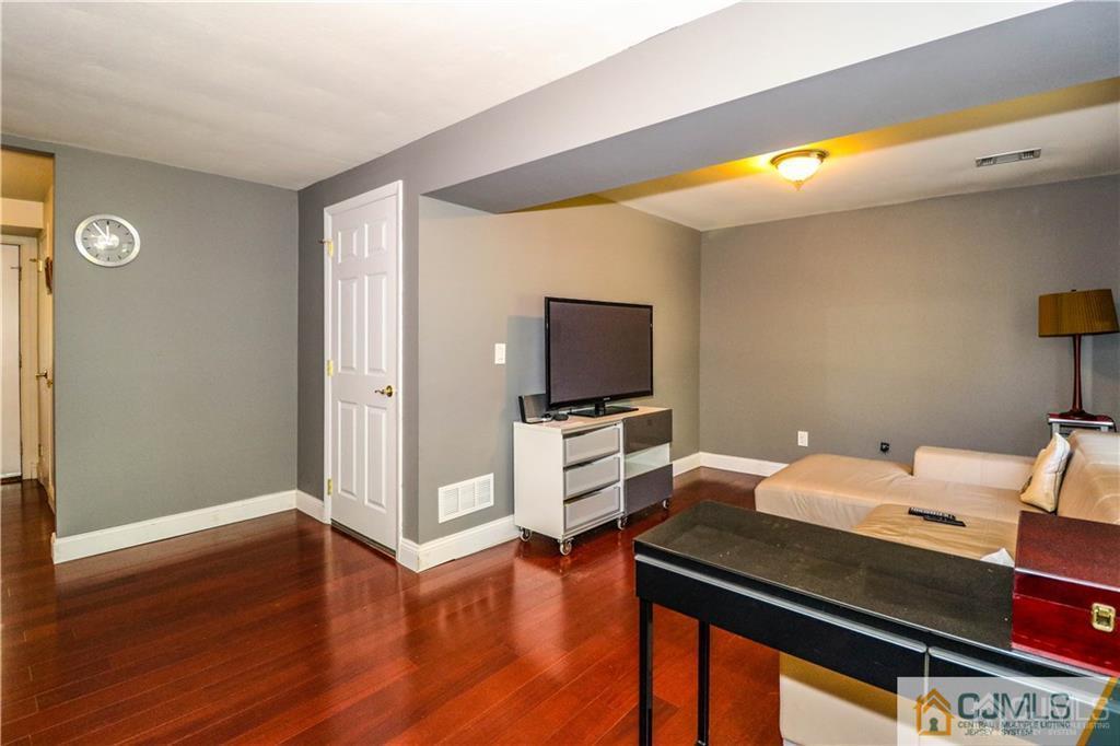 39 Outcalt Road Edison, NJ 08817 - Photo 5 of 17 a bedroom with furniture and a wooden floor