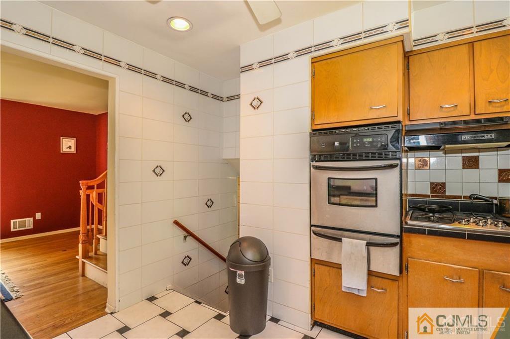 39 Outcalt Road Edison, NJ 08817 - Photo 8 of 17 a bathroom with a granite countertop sink a mirror and shower
