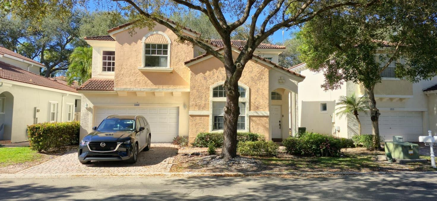 a front view of a house with a yard