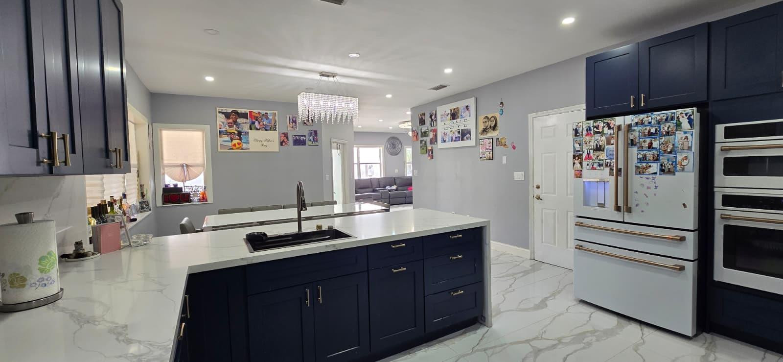 1888 Northwest 75th Way Hollywood, FL 33024 - Photo 16 of 45 a kitchen with a sink refrigerator and cabinets