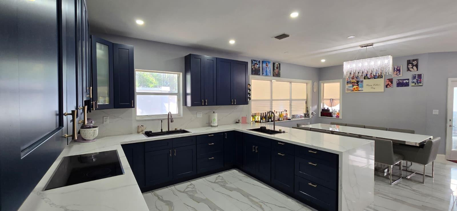 1888 Northwest 75th Way Hollywood, FL 33024 - Photo 17 of 45 a kitchen with a sink a window and cabinets