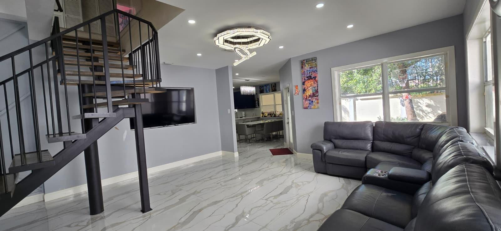 1888 Northwest 75th Way Hollywood, FL 33024 - Photo 20 of 45 a living room with furniture and a flat screen tv