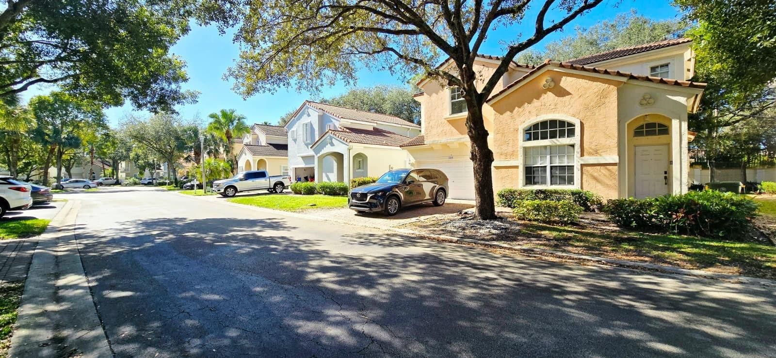 1888 Northwest 75th Way Hollywood, FL 33024 - Photo 2 of 45 a view of a white house with a yard and sitting area