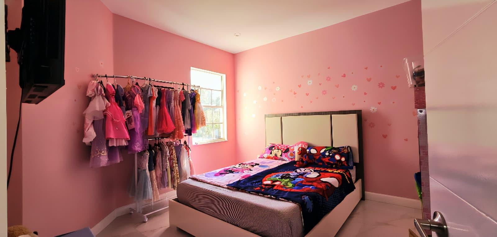 1888 Northwest 75th Way Hollywood, FL 33024 - Photo 31 of 45 a bed room with furniture and a flat screen tv