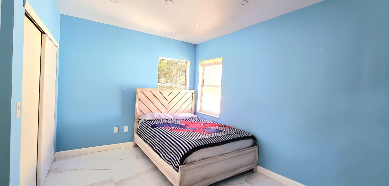 1888 Northwest 75th Way Hollywood, FL 33024 - Photo 32 of 45 a bedroom with a bed and a window