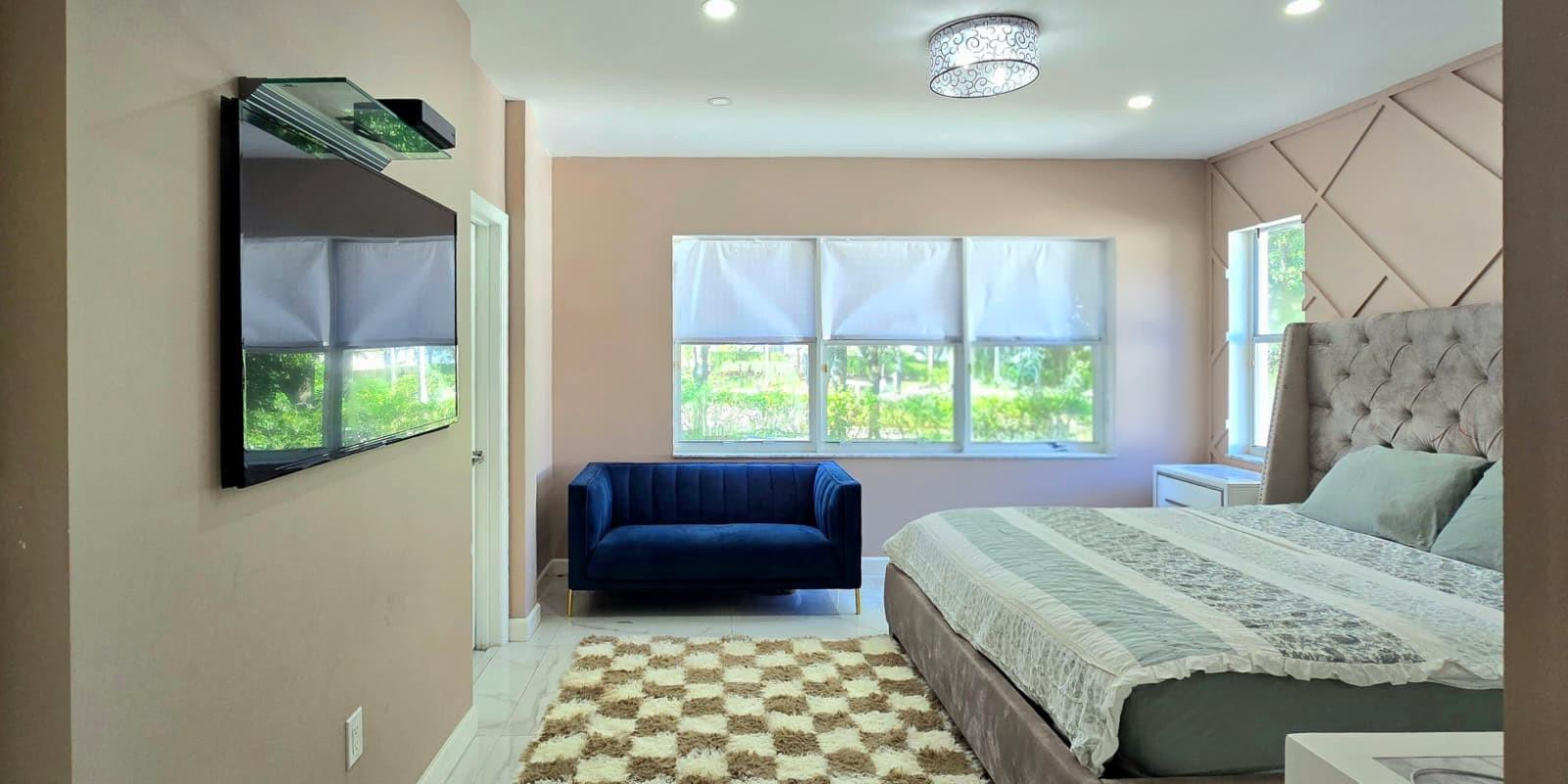 1888 Northwest 75th Way Hollywood, FL 33024 - Photo 33 of 45 a bedroom with a bed and a couch