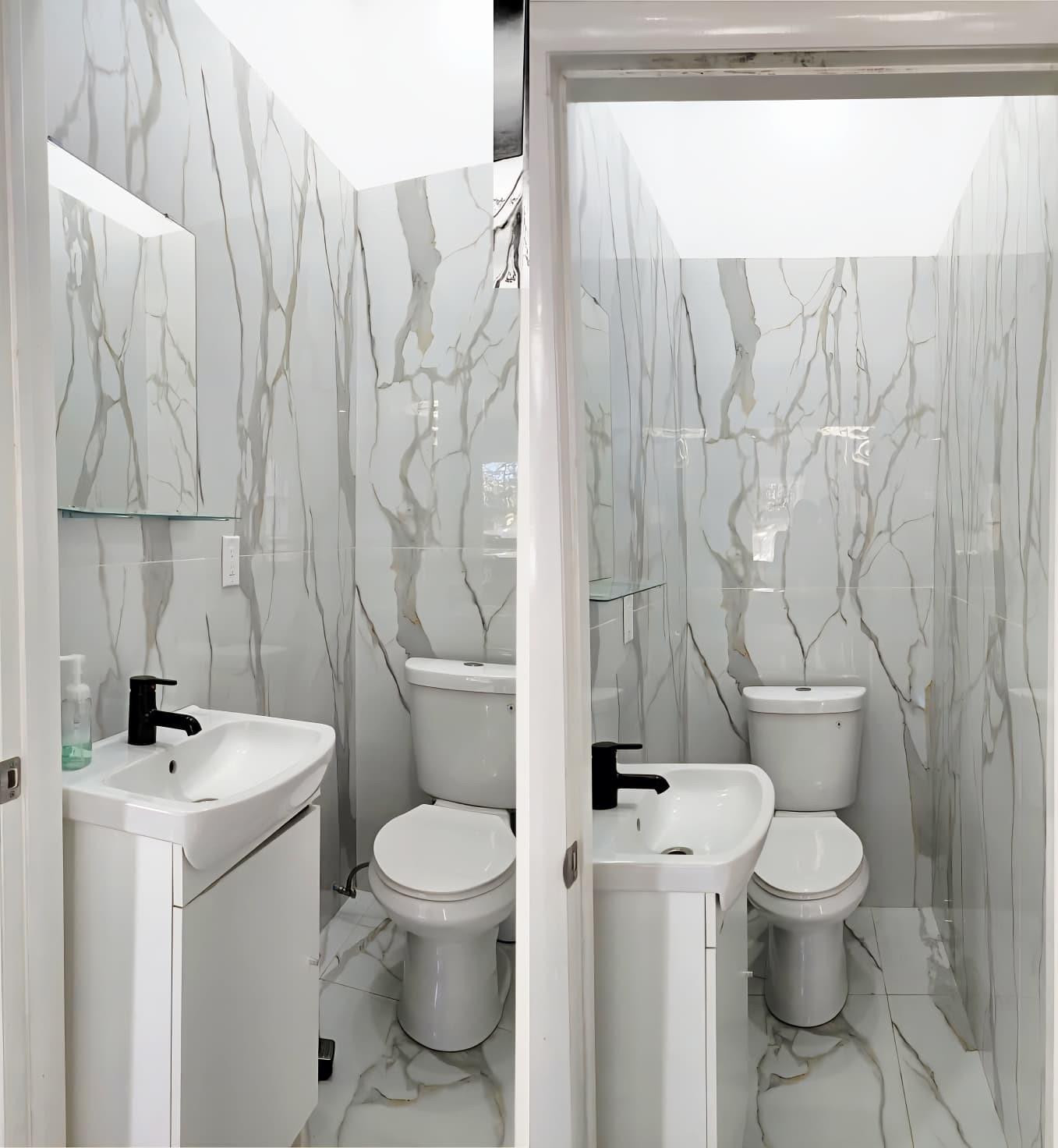 1888 Northwest 75th Way Hollywood, FL 33024 - Photo 34 of 45 a white toilet sitting next to a bathroom sink