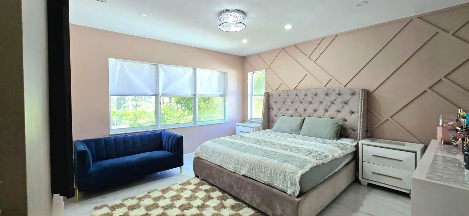 1888 Northwest 75th Way Hollywood, FL 33024 - Photo 35 of 45 a bed sitting in a spacious bedroom next to a window