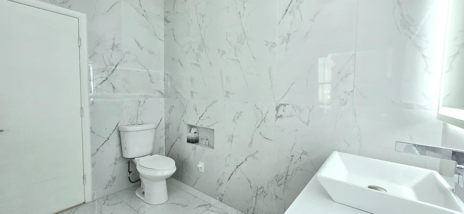 1888 Northwest 75th Way Hollywood, FL 33024 - Photo 39 of 45 a bathroom with a toilet and a sink