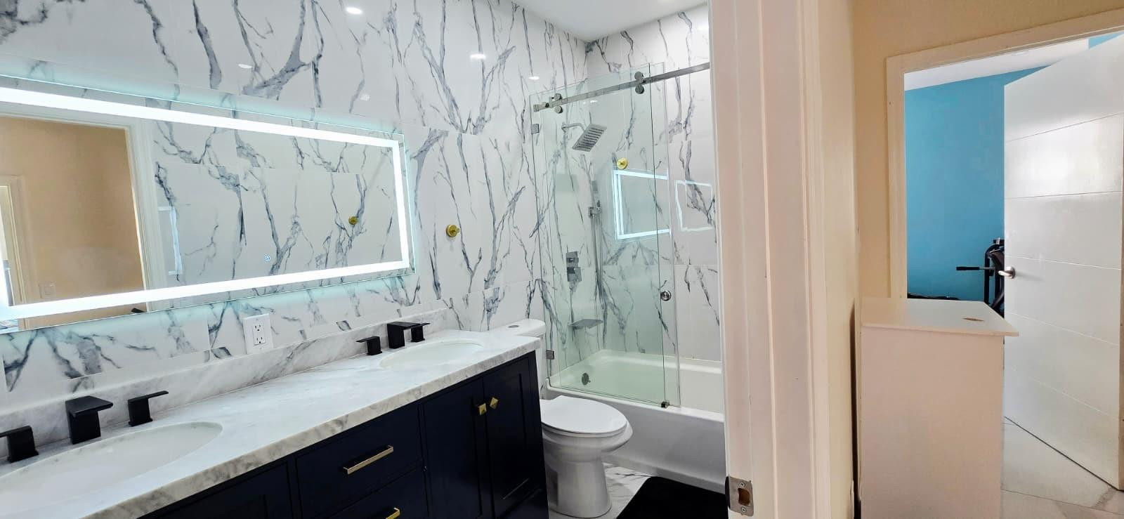 1888 Northwest 75th Way Hollywood, FL 33024 - Photo 42 of 45 a bathroom with a double vanity sink toilet and shower