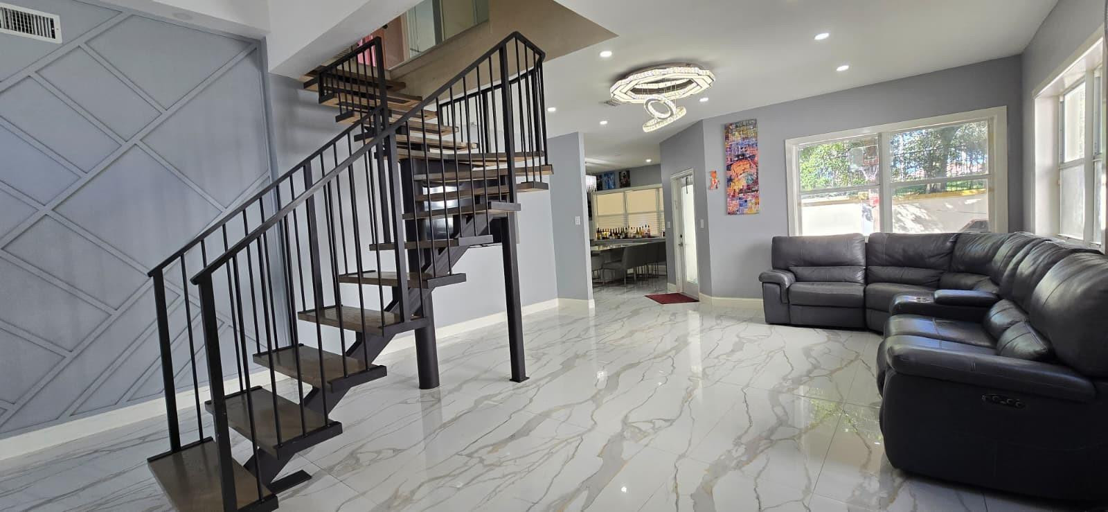 1888 Northwest 75th Way Hollywood, FL 33024 - Photo 10 of 45 a living room with furniture or wooden floor and a large window